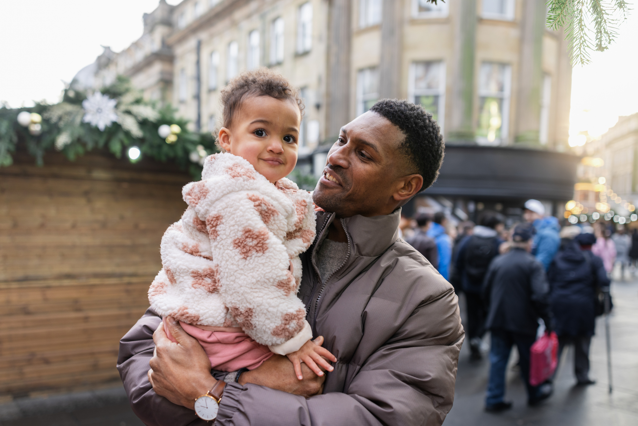 Man holding a young child